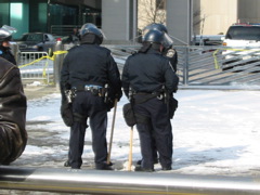 Cops with billy clubs