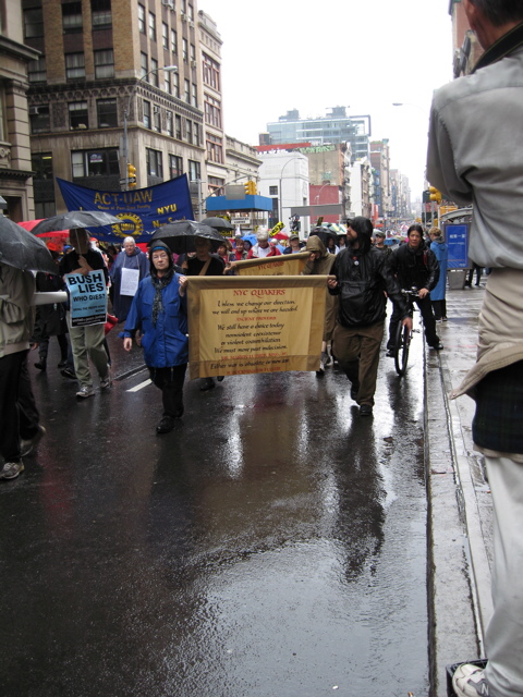 Quakers carry signs