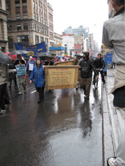 Quakers carry signs