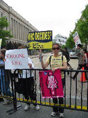 Pro-choice protester infiltrates behind the  anti-choice barrier
